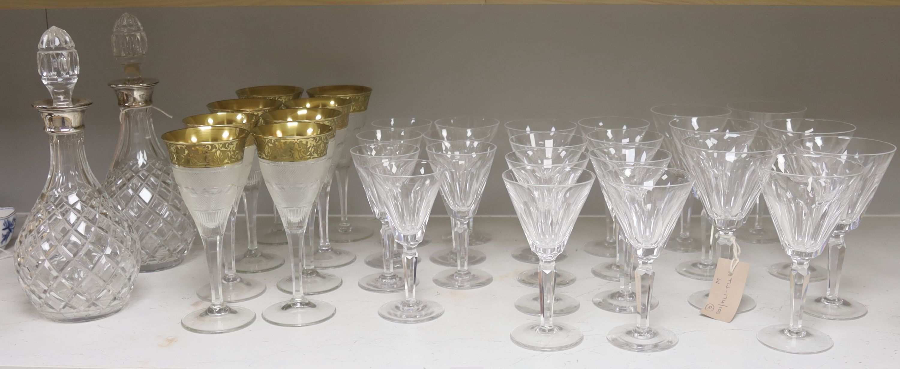 A pair of cut glass silver-mounted decanters and a quantity of cut crystal table glassware